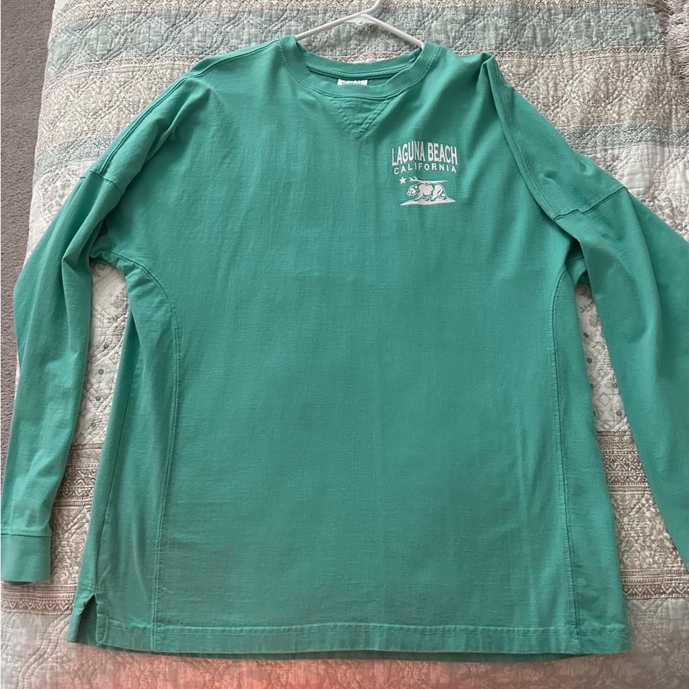 Laguna Beach long sleeve t-shirt. Worn once. Like new condition. Size medium.